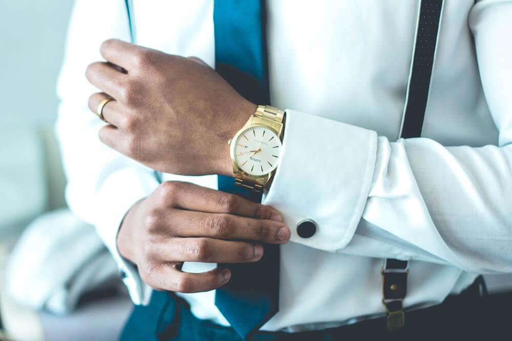 A man wearing an expensive watch for men.